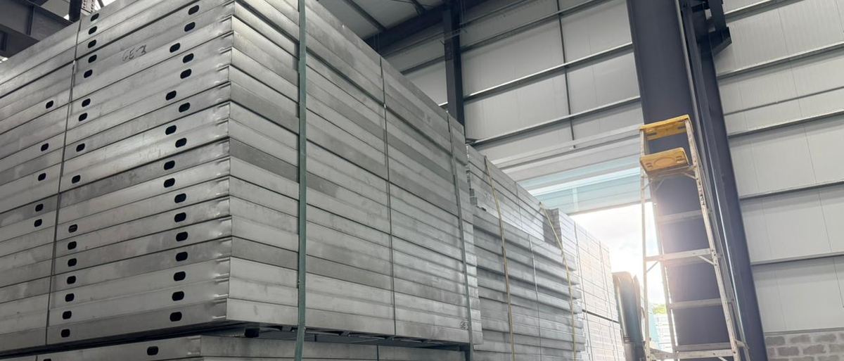 Pre-assembled structural panels stacked in the plant