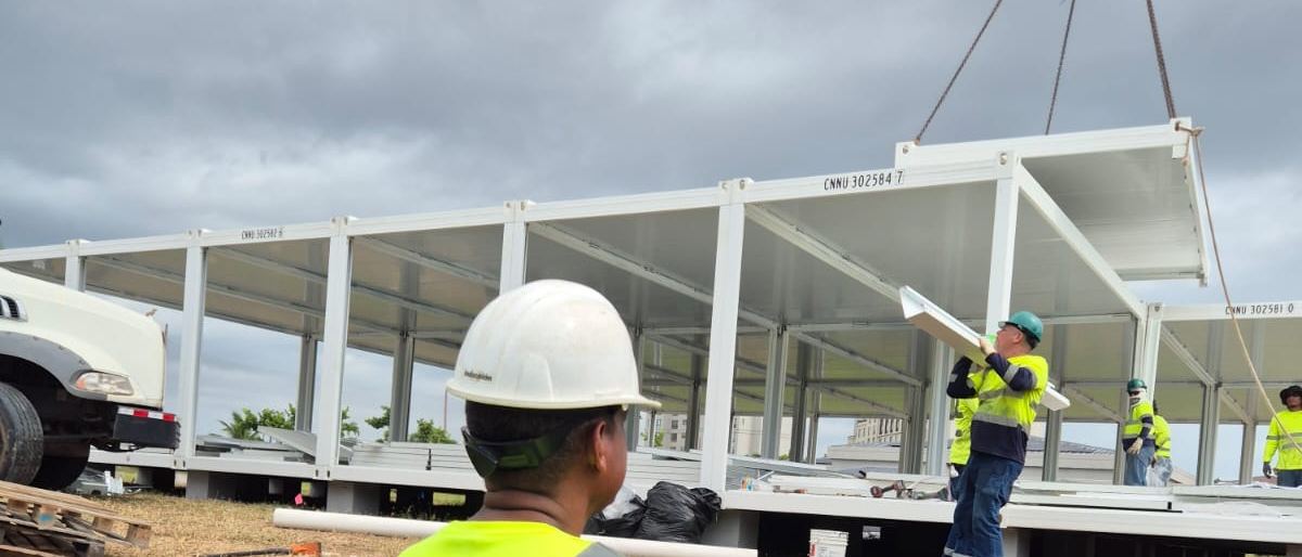 A structural module being lifted on site